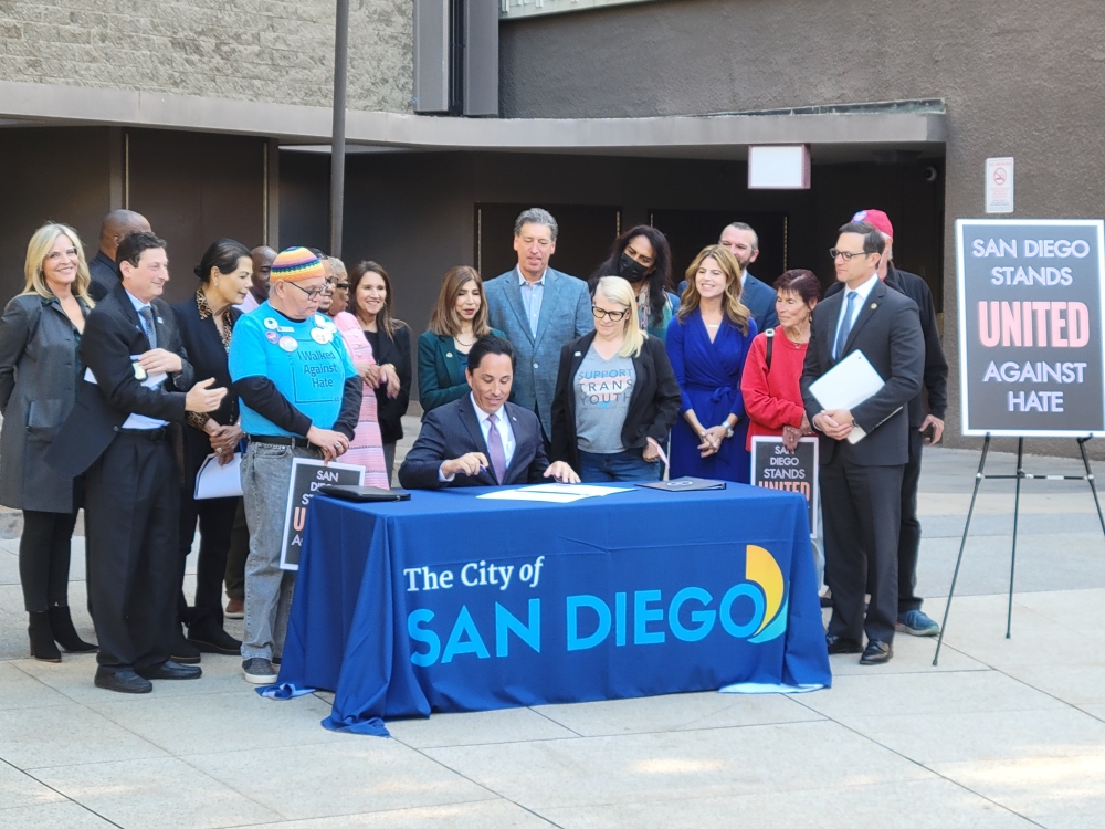 Group of people signing proclamation 