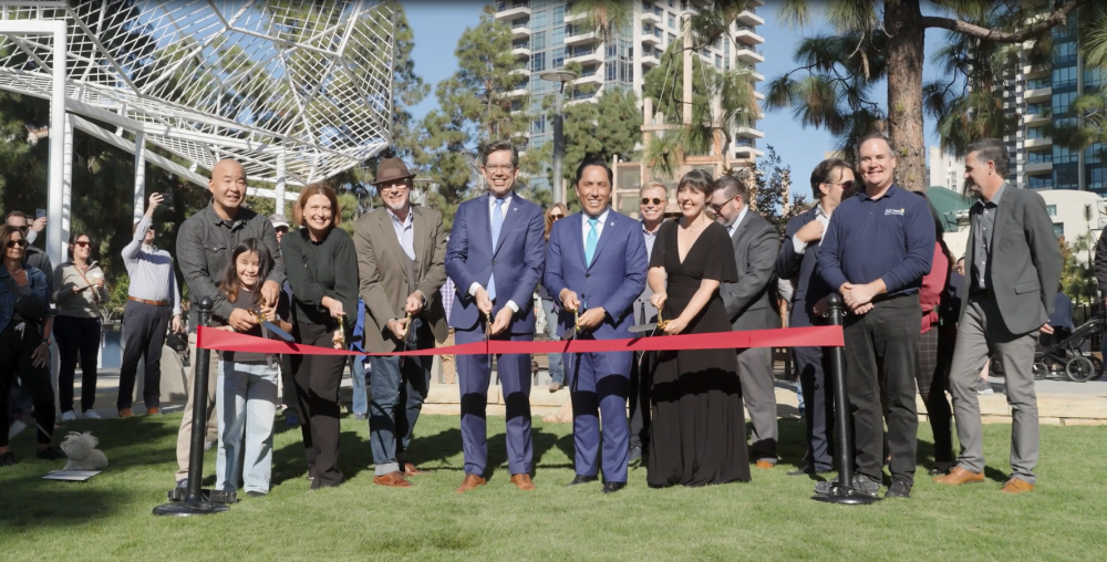 Mayor, Councilmember, community leaders, and City staff cutting ribbon. 