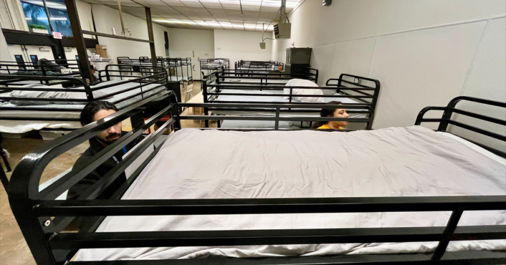 Staff setting up beds at Old Central Library