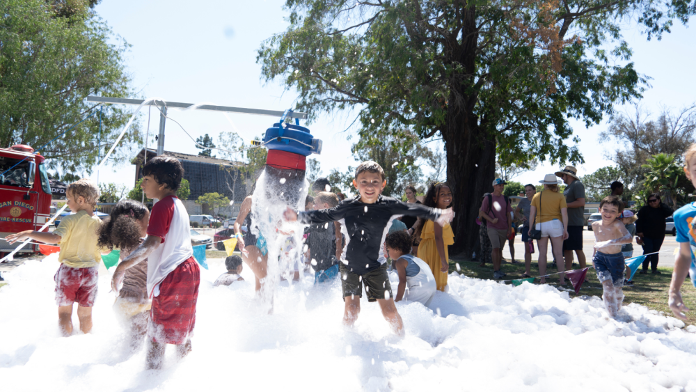 kid in bubble foam at aquafest 