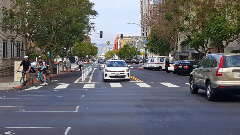 street with cars and bikers 