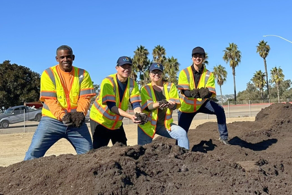 City staffers at a compost facility