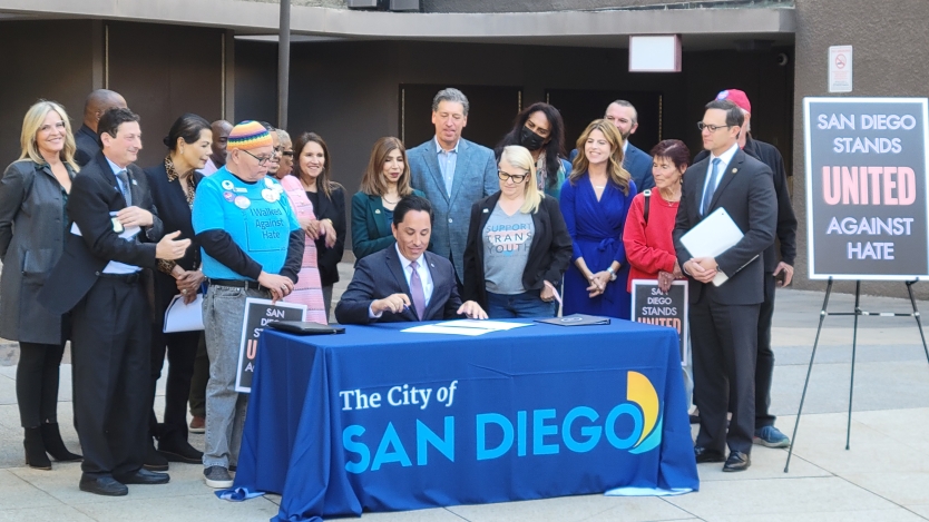 Group of people signing proclamation 