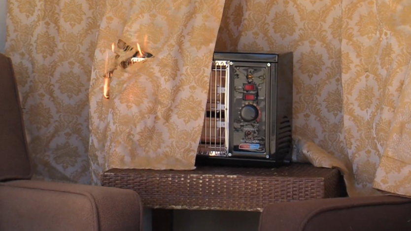 curtain covering a space heater which results in catching on fire. 