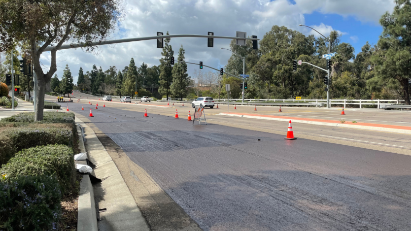 Far right lane of camino del sur getting slurry treatment. protected by cones,