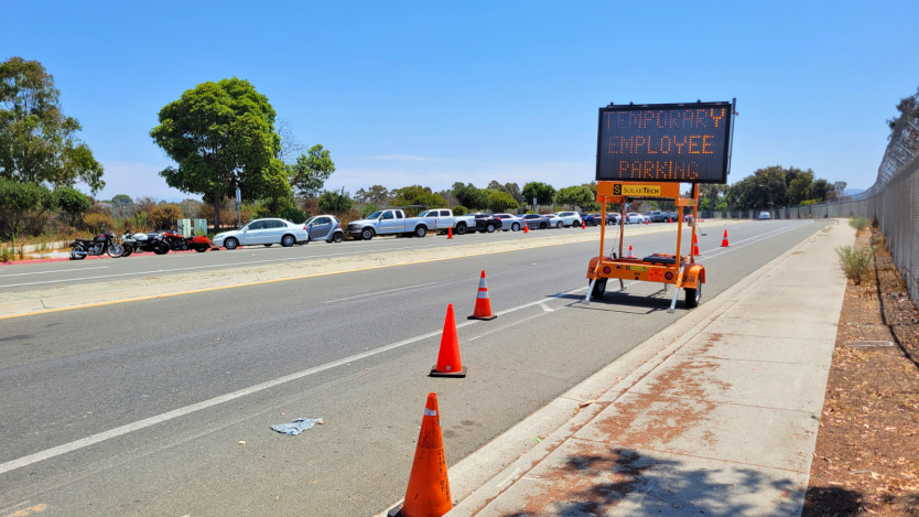 temporary employee parking sign and traffic cones 