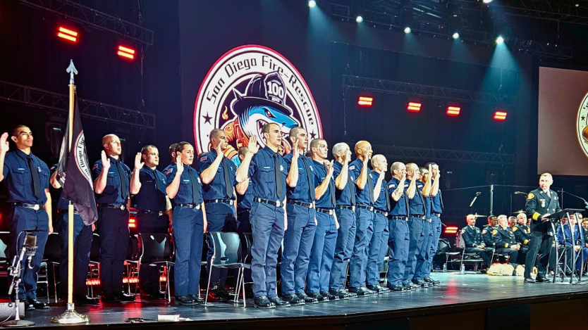 firefighters on stage saluting