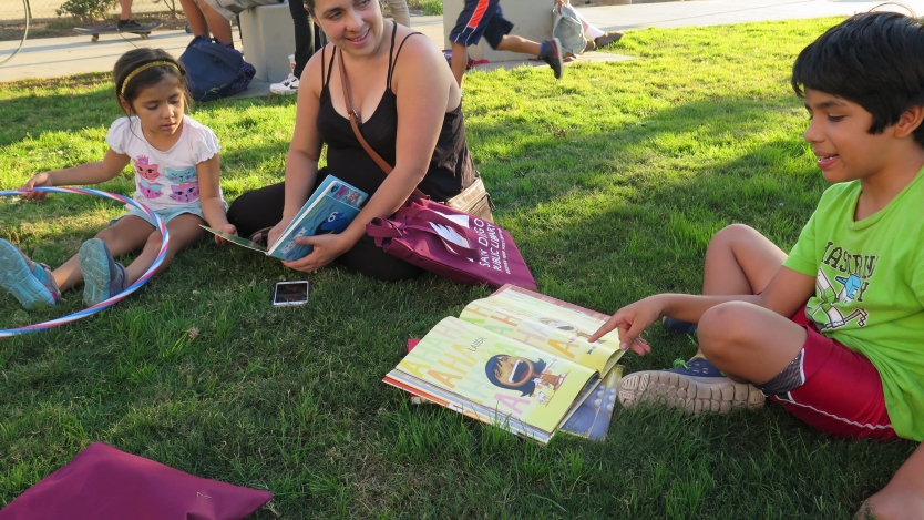 Kids reading outdoors